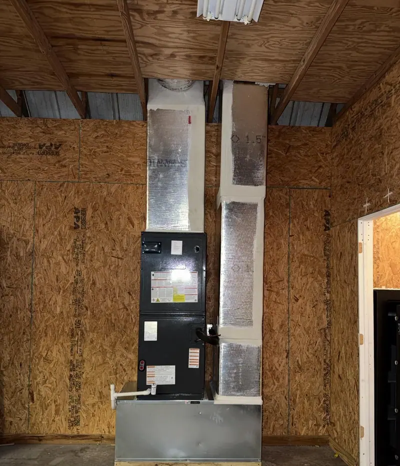Air handler with insulated fiberglass duct connections in an unfinished space